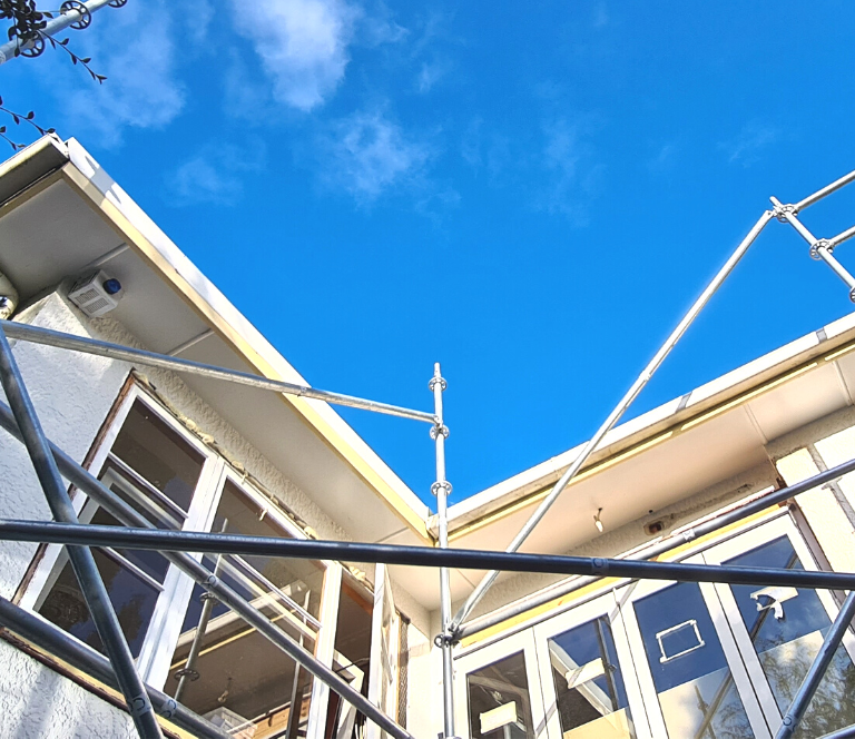 House partially wrapped in scaffolding as it is being renovated by Woodfort Construction